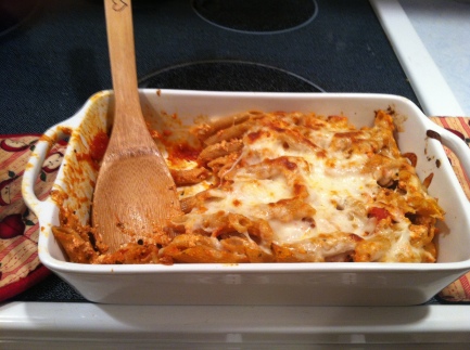 Baked pasta with homemade ricotta and tomato sauce, topped with mozzarella.